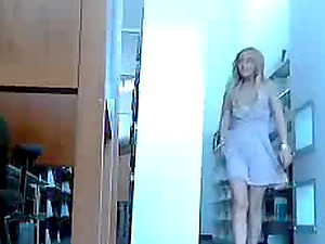 Blonde girl using a dildo in public
