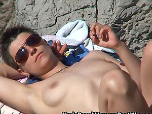 Horny women on nudist beach showing their breasts